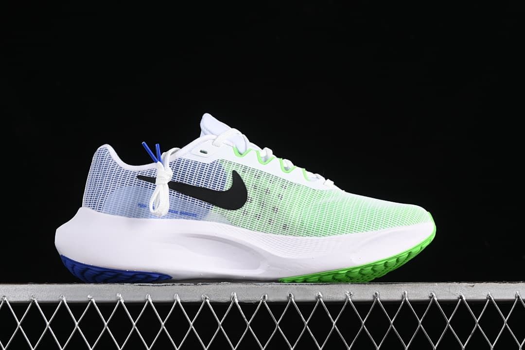 Side view of the shoe showing the mesh upper, black Swoosh, and green-and-blue outsole