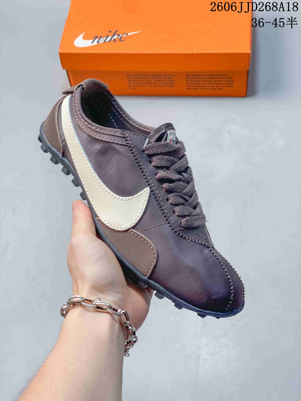 Angled side view of the sneaker, showing its low profile and contrasting Swoosh.
