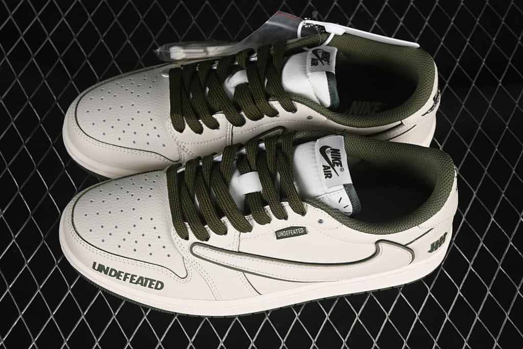 Overhead view of a pair of off-white and olive low-top sneakers with contrast laces