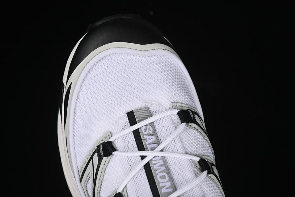 Top-down close-up of the mesh toe and lacing.