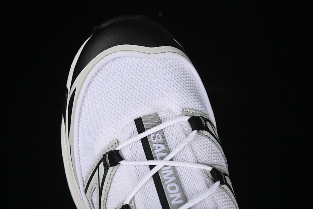 Top-down close-up of the mesh toe and lacing.