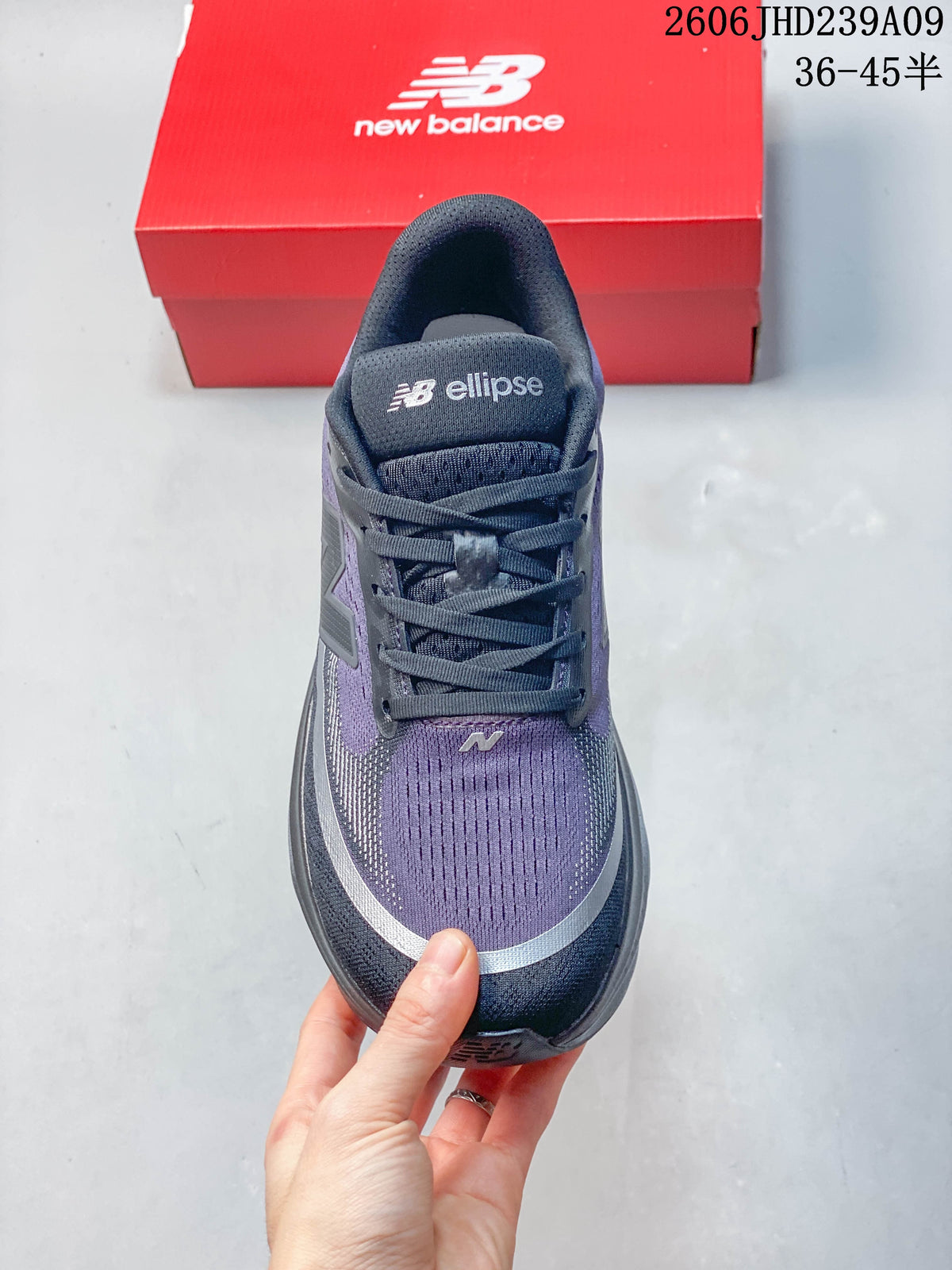 Top view of the shoe showing its laces and purple mesh-look upper