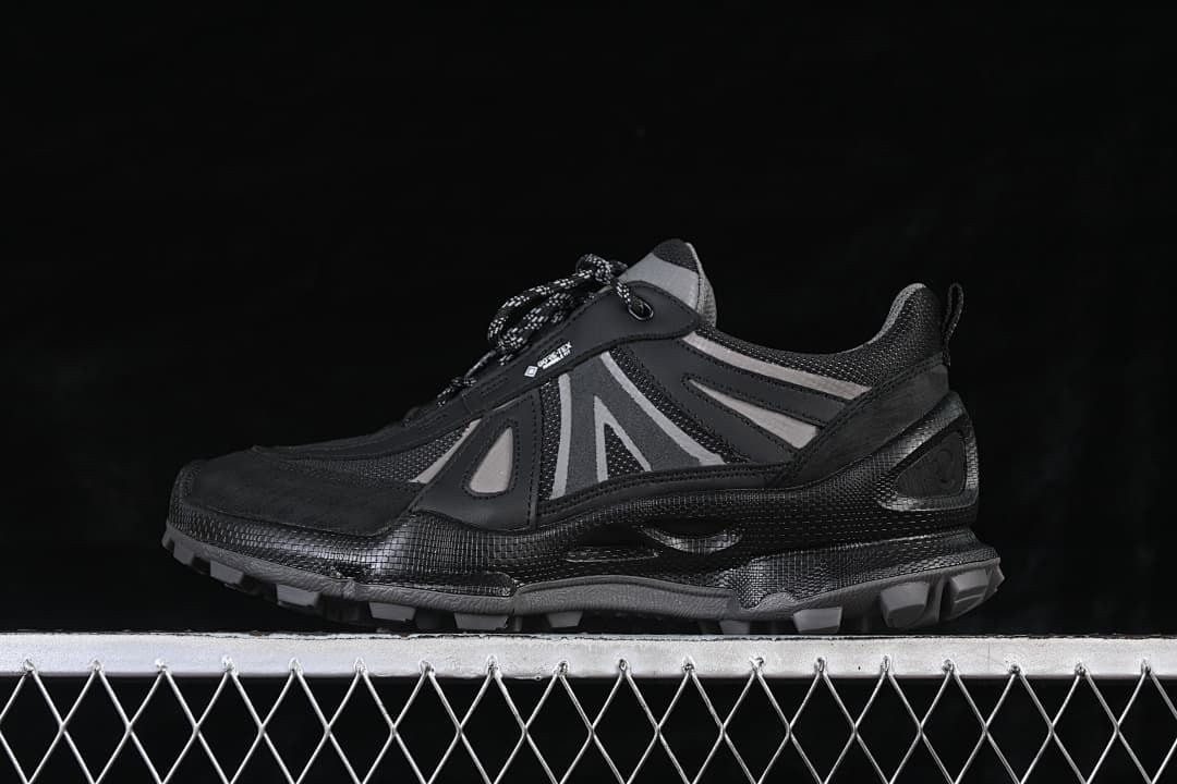 Side view of black and grey ECCO BIOM C trail-style sneaker