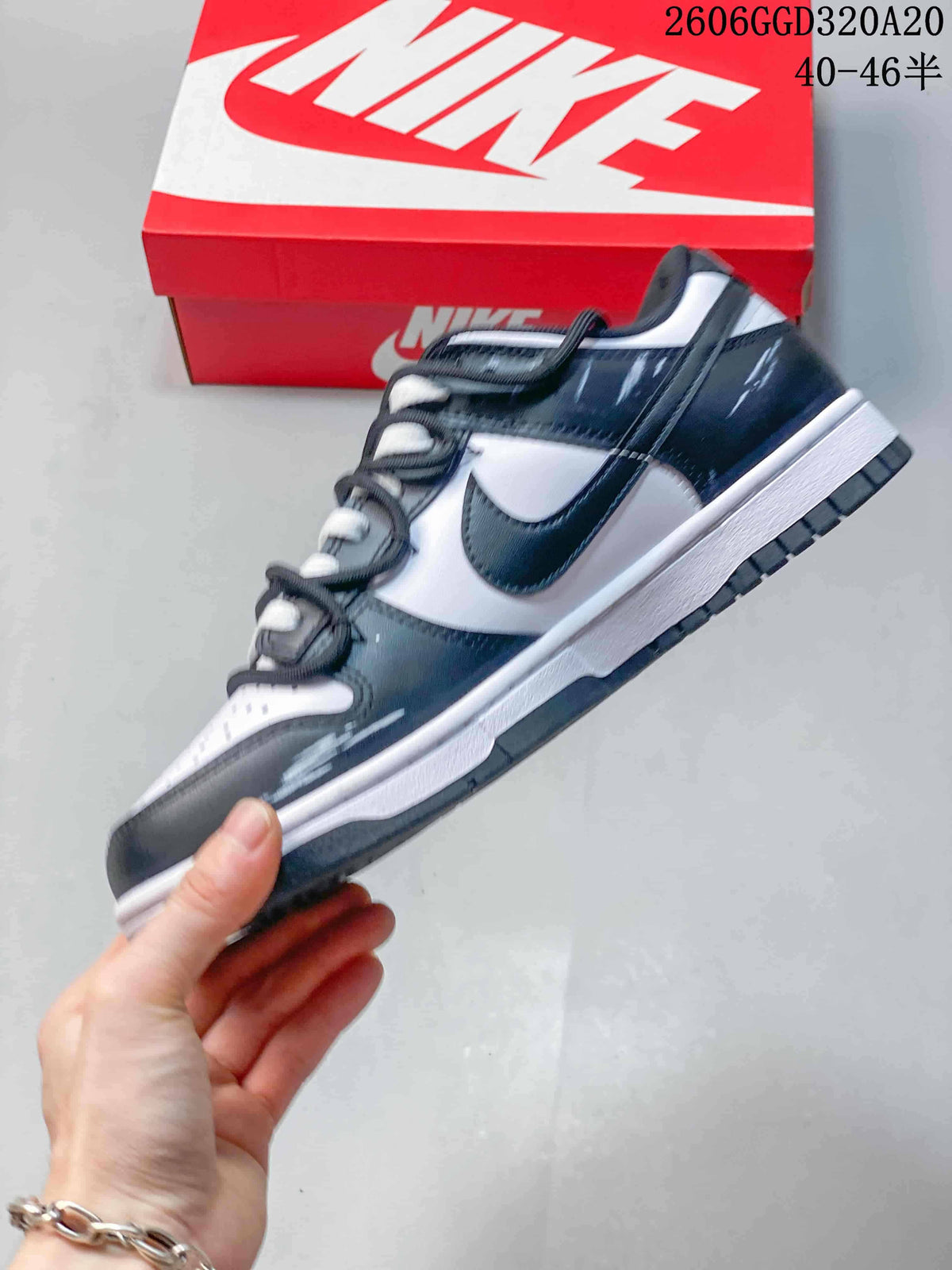 Side view showing graphic panels and contrasting swoosh on a low-top sneaker