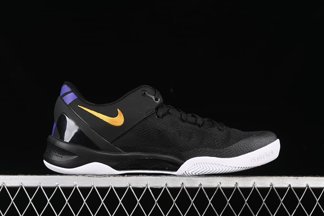 Side profile of a black Kobe 8 Protro shoe with gold accents and white outsole