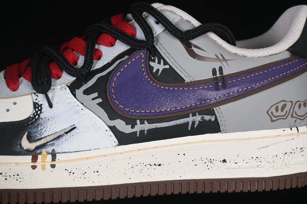 Close-up of purple Swoosh and graffiti-style side graphics