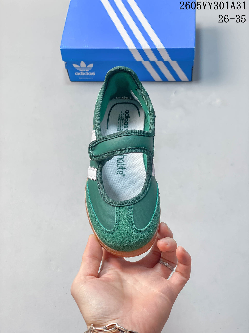 Top view of the green Mary Jane-style shoe with a hook-and-loop strap