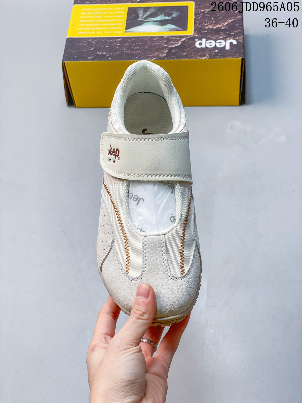 Top view of the cream shoe showing its rounded toe and wide instep strap