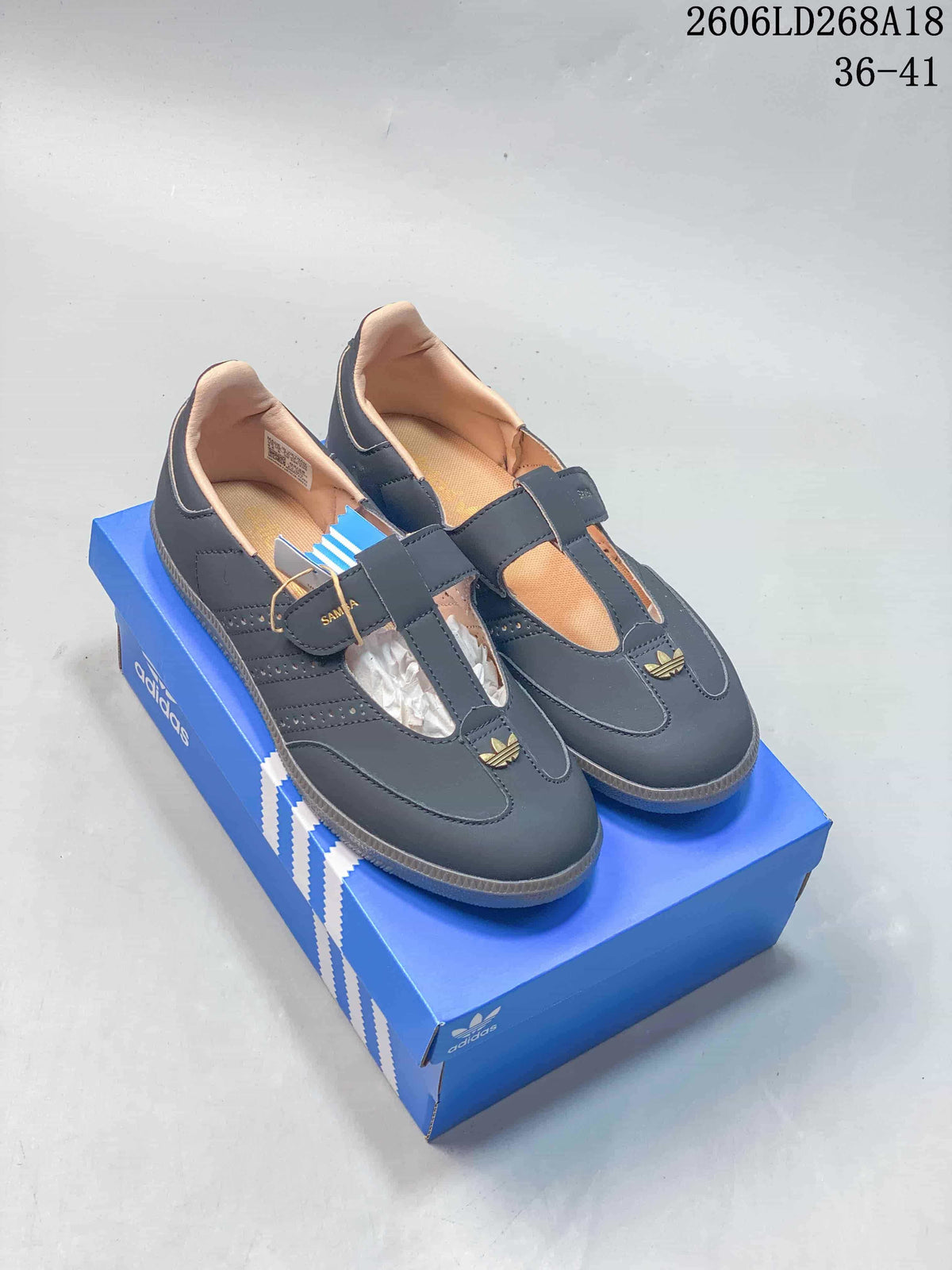 Pair of dark gray adidas Originals Samba Jane shoes with T-straps and gum-look soles