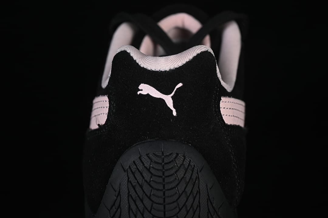 Rear view showing the Puma logo, heel, and patterned black outsole.