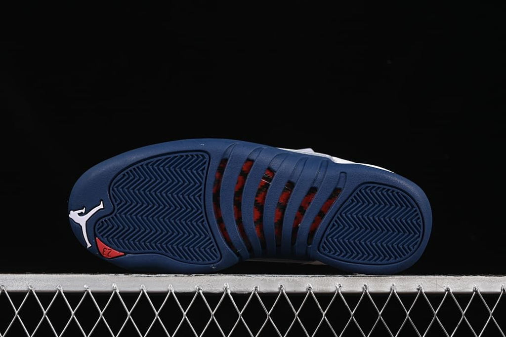 Navy outsole with patterned tread and red details