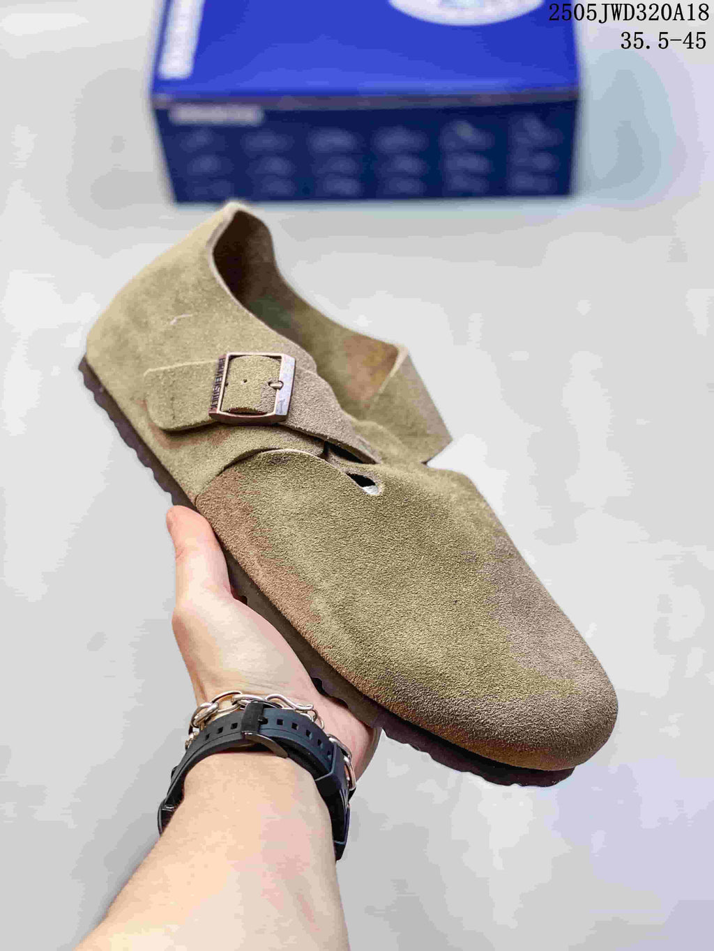 Olive-toned closed-toe clog with two buckle straps; a box is visible in the background.