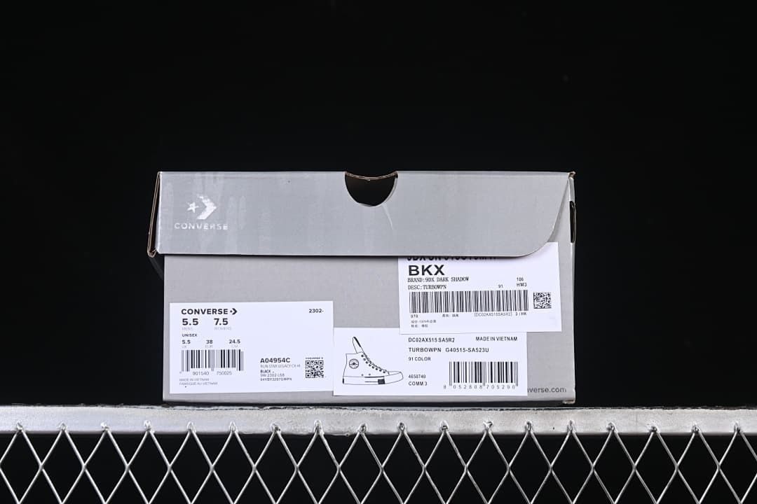 Shoe box displaying Converse labels and a size label