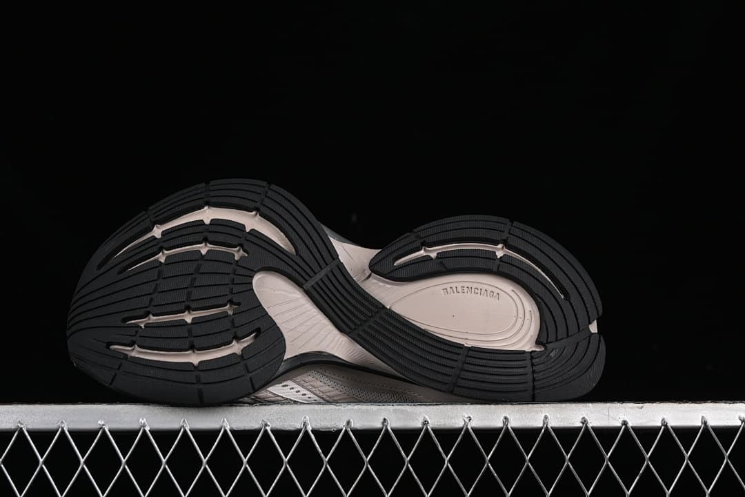 Underside view of the black tread and sculpted outsole