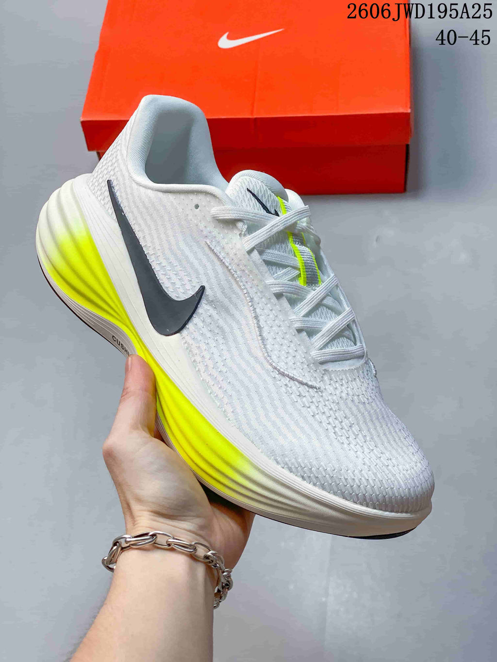 White running shoe with a dark side Swoosh and fluorescent yellow midsole accents.