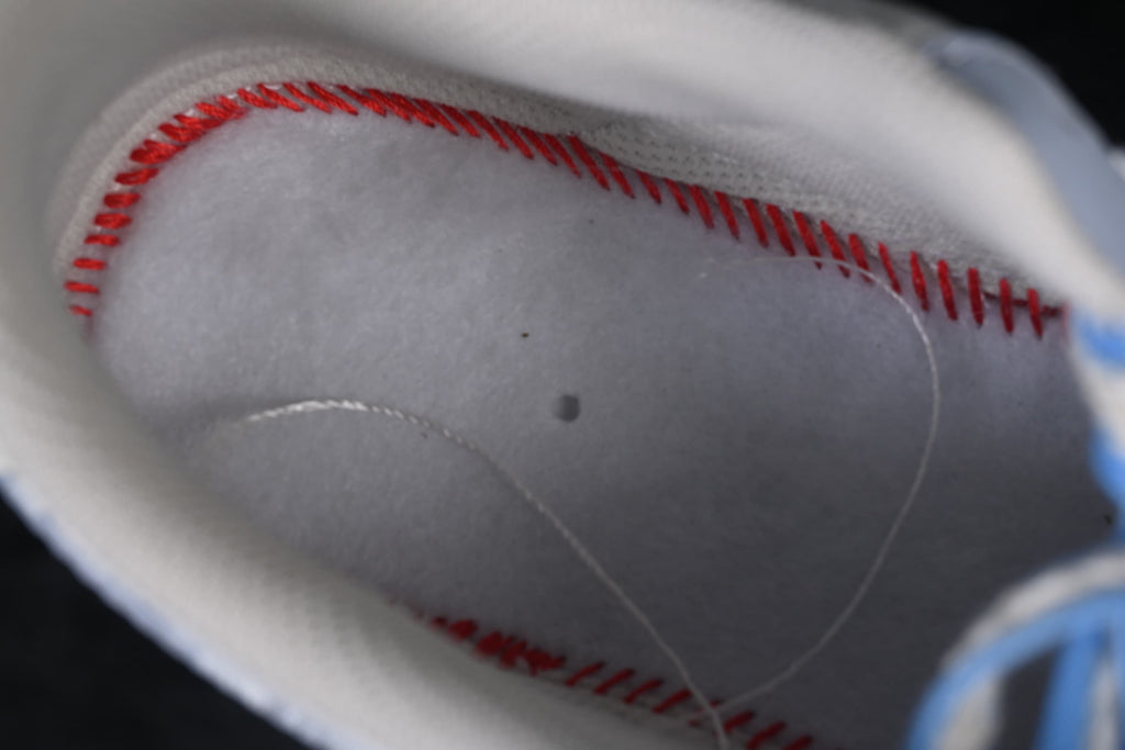 Interior detail showing red stitching beneath the insole area