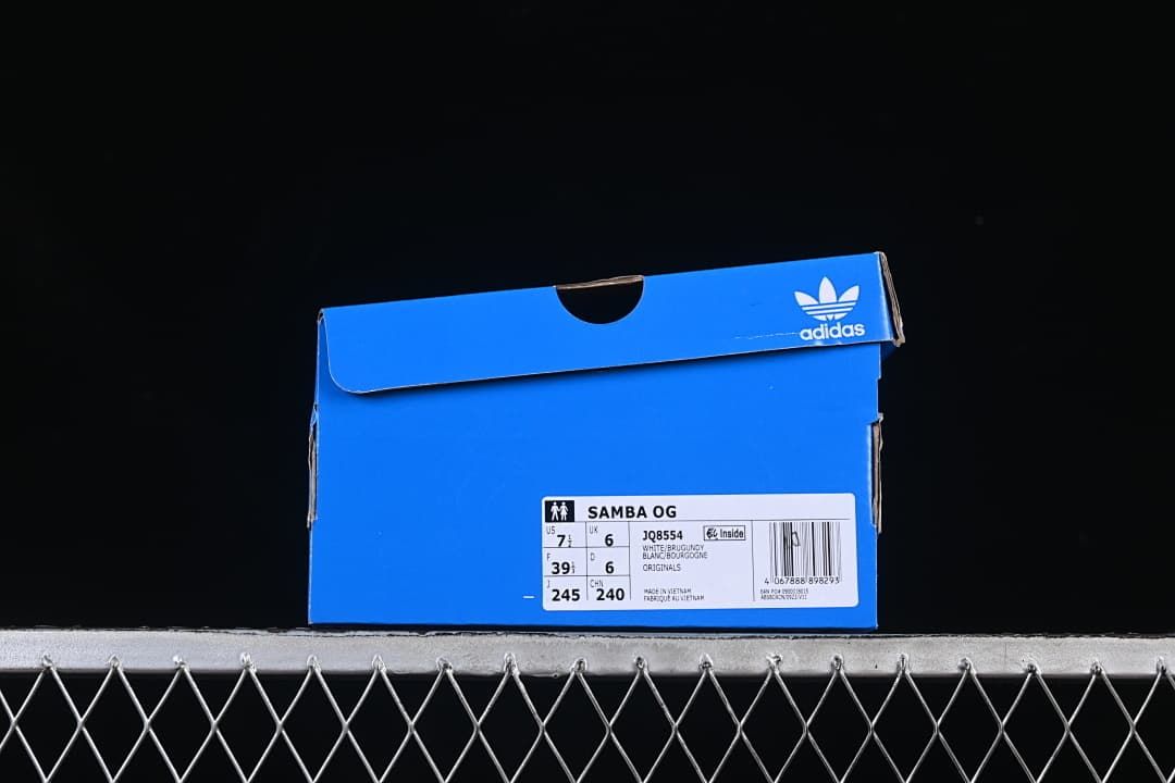Blue adidas shoe box with a label identifying Samba OG, style JQ8554, and sample size information.
