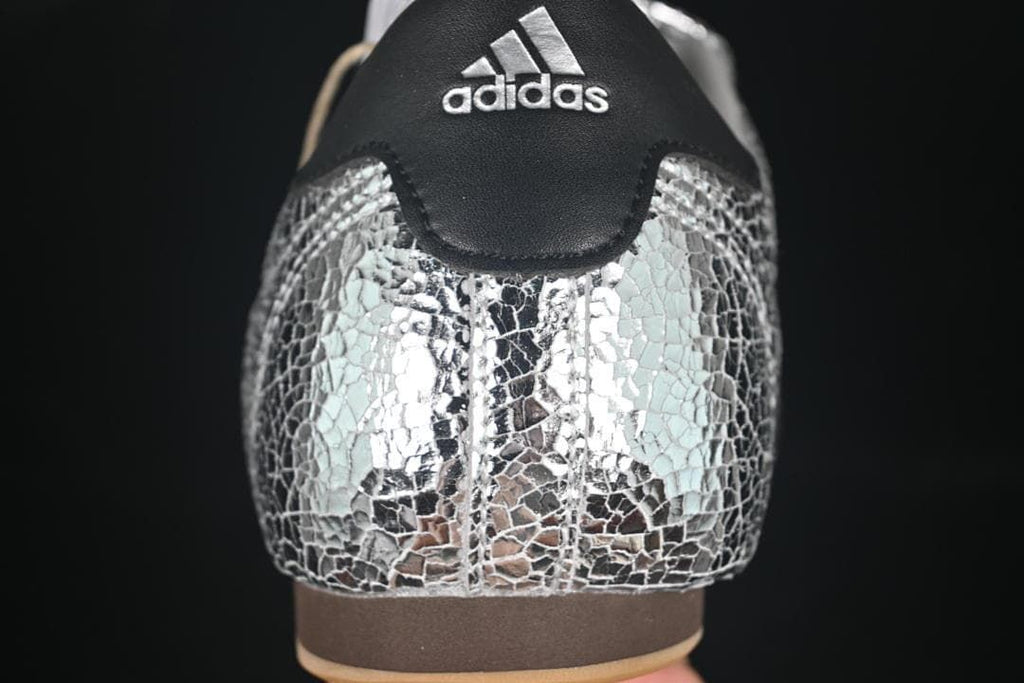 Rear view highlighting the silver crackle-pattern upper and black heel panel.