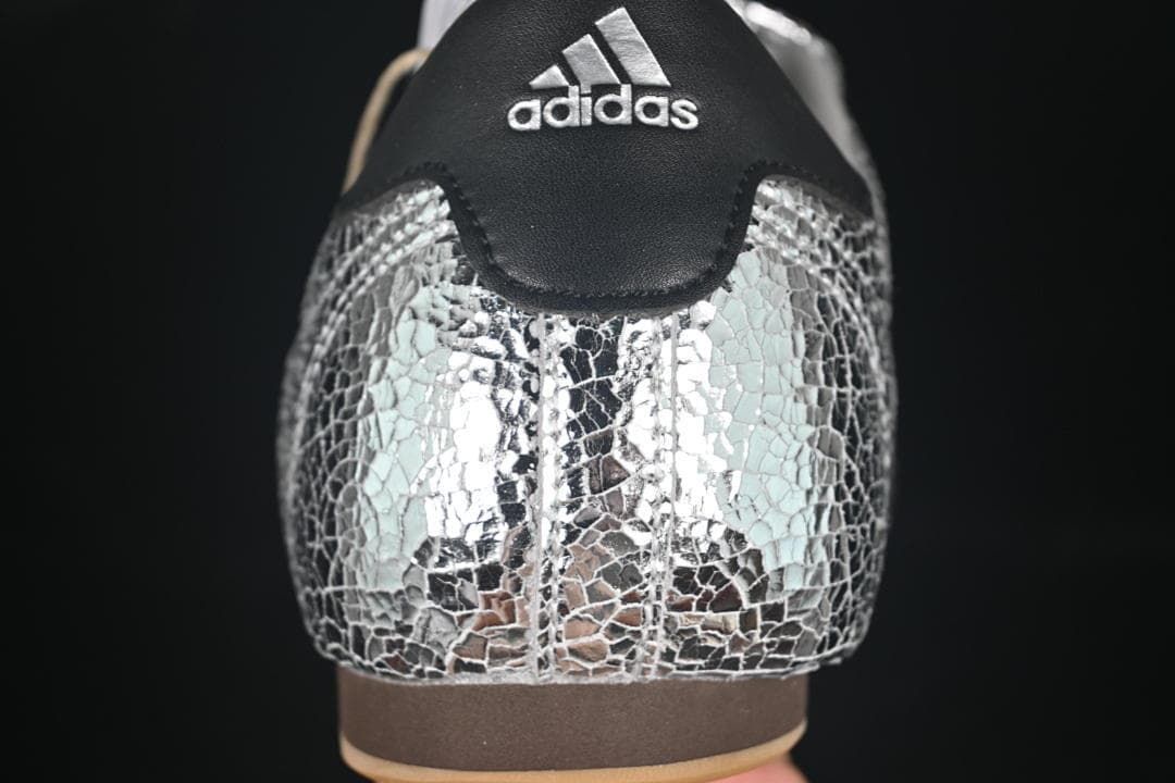 Rear view highlighting the silver crackle-pattern upper and black heel panel.