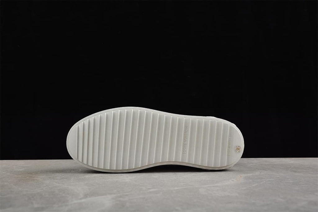 Underside showing the ridged outsole and size 36 marking