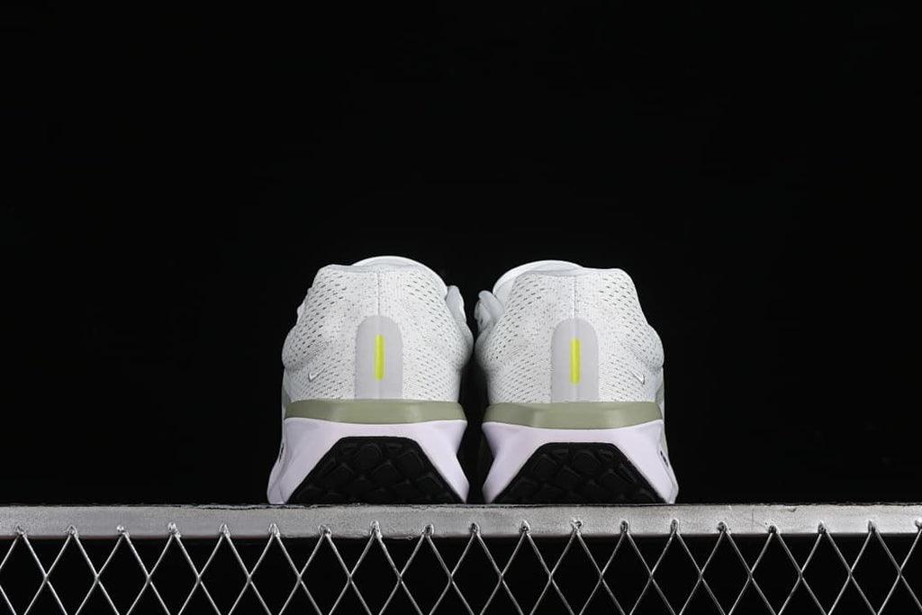 Rear view of the pair showing heel details and black outsole sections.