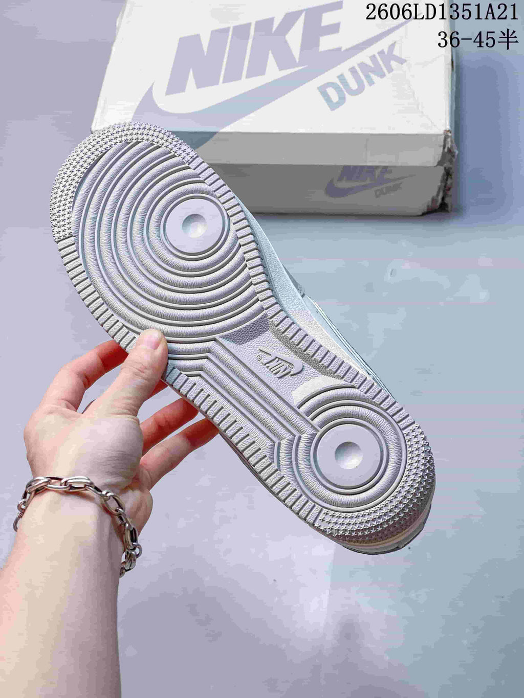 Close-up of the circular tread pattern on the sneaker outsole