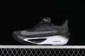 Side view of black and gray Nike Zoom Fly 6 running shoe with a white midsole