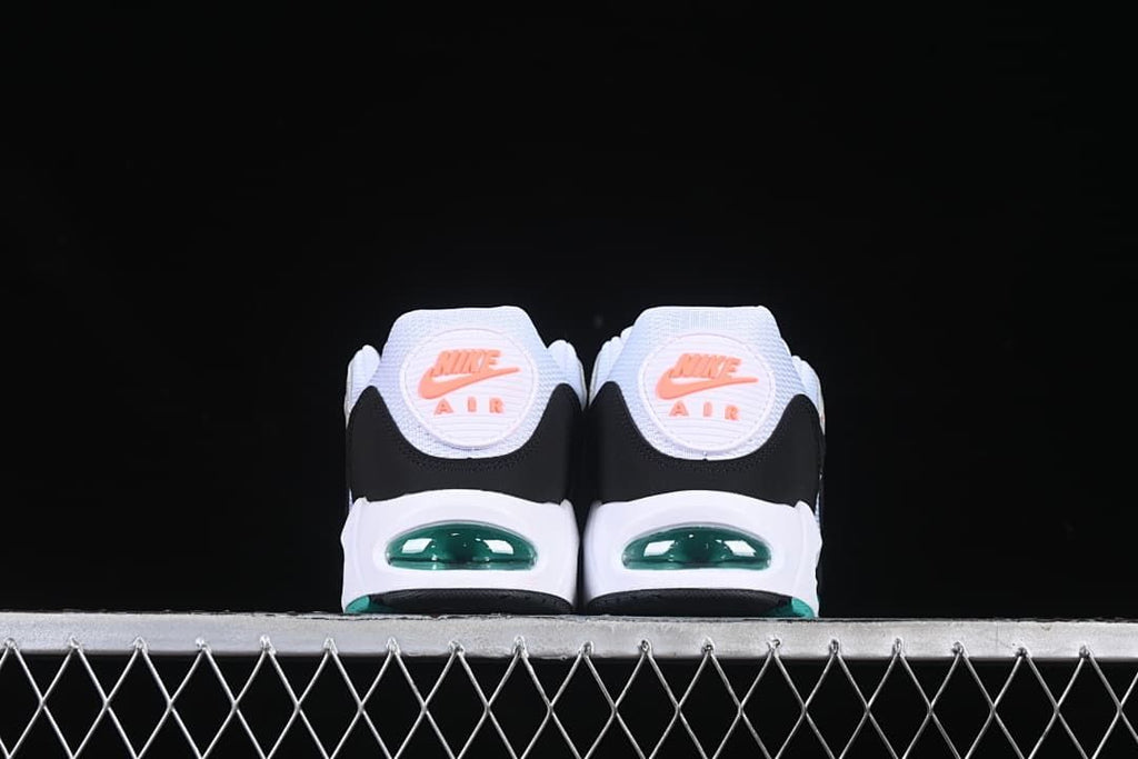 Rear view of both sneakers showing coral heel emblems and teal-tinted air units.