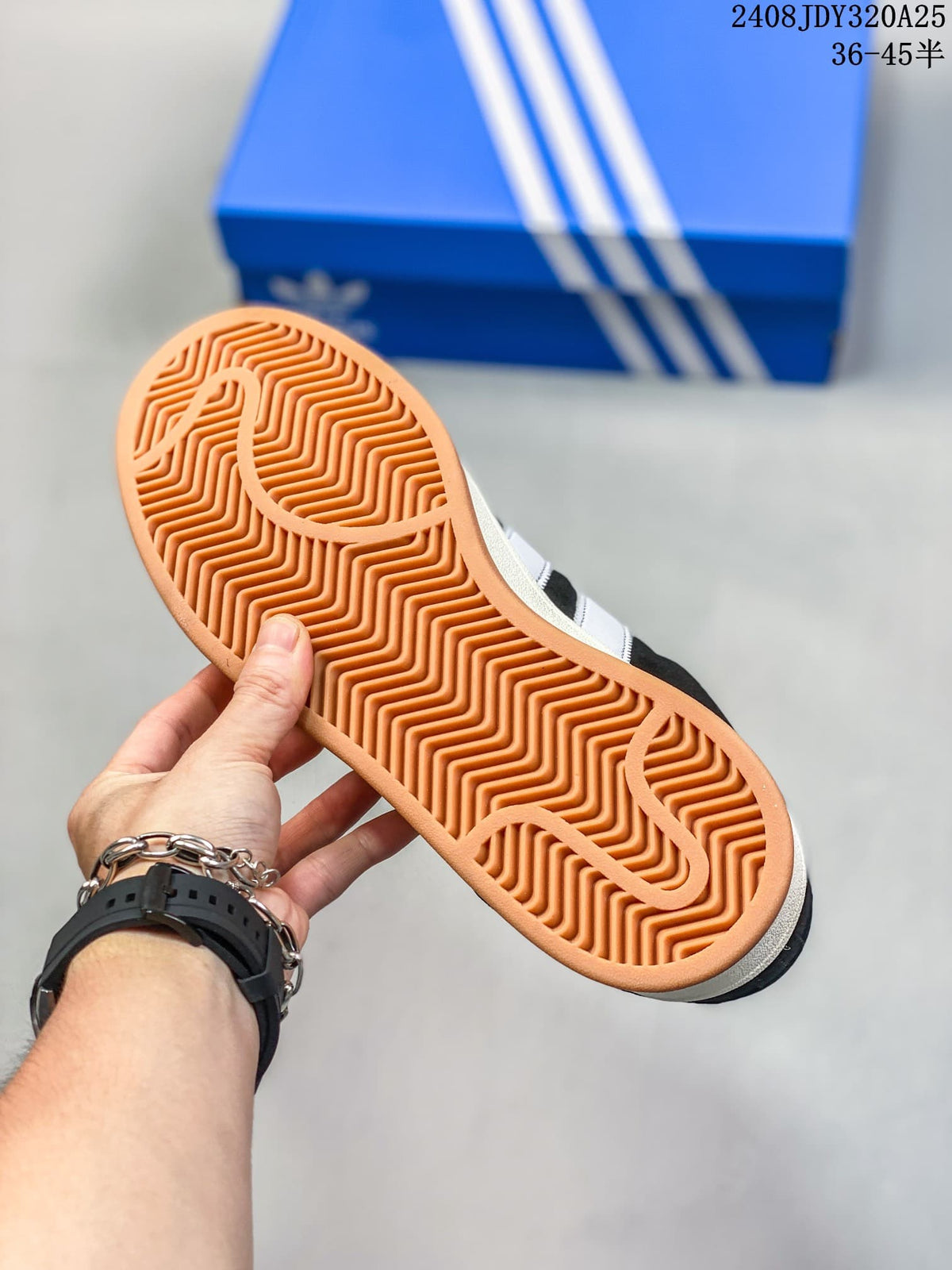 Close-up of the gum-colored outsole and tread on a black-and-white Campus 00s sneaker.