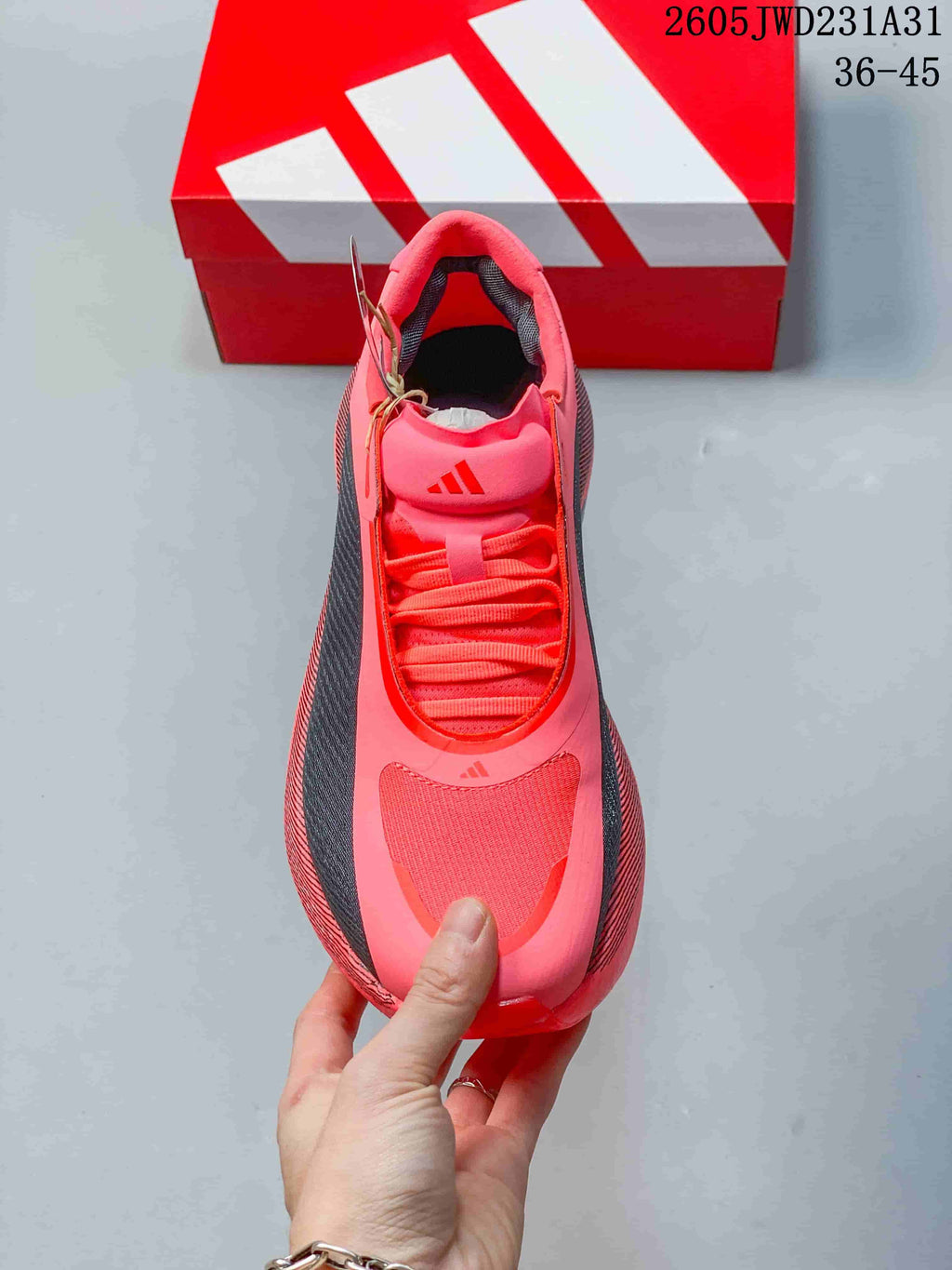 Top view of the bright pink lace-up shoe with dark side panels.