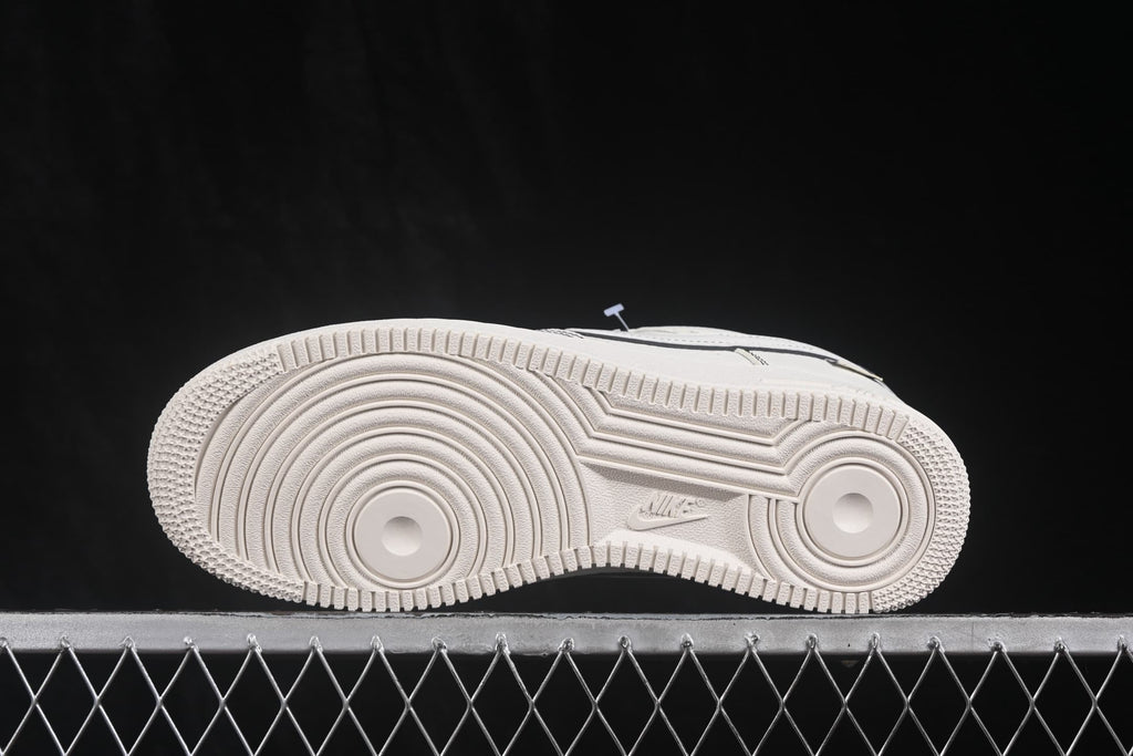 Side view of the white outsole with circular forefoot and heel traction grooves.