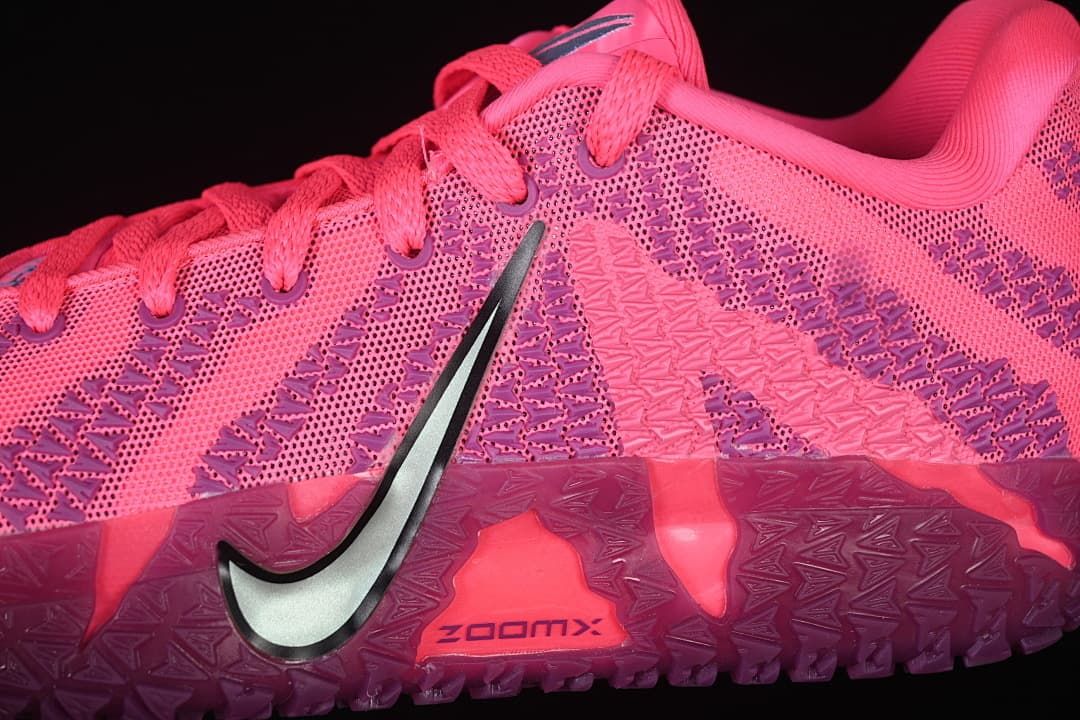Side close-up of the patterned upper, Swoosh, and textured outsole