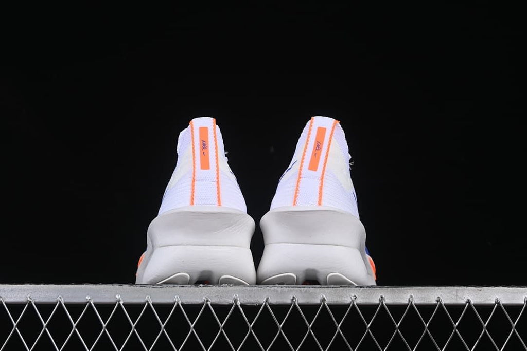 Rear view of both shoes with orange heel strips.