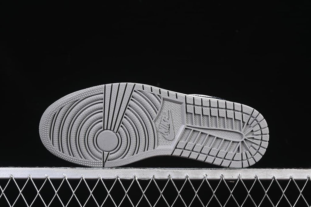 Underside view showing the gray patterned outsole.