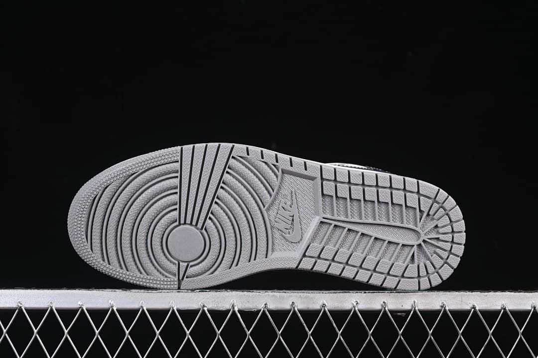 Underside view showing the gray patterned outsole.