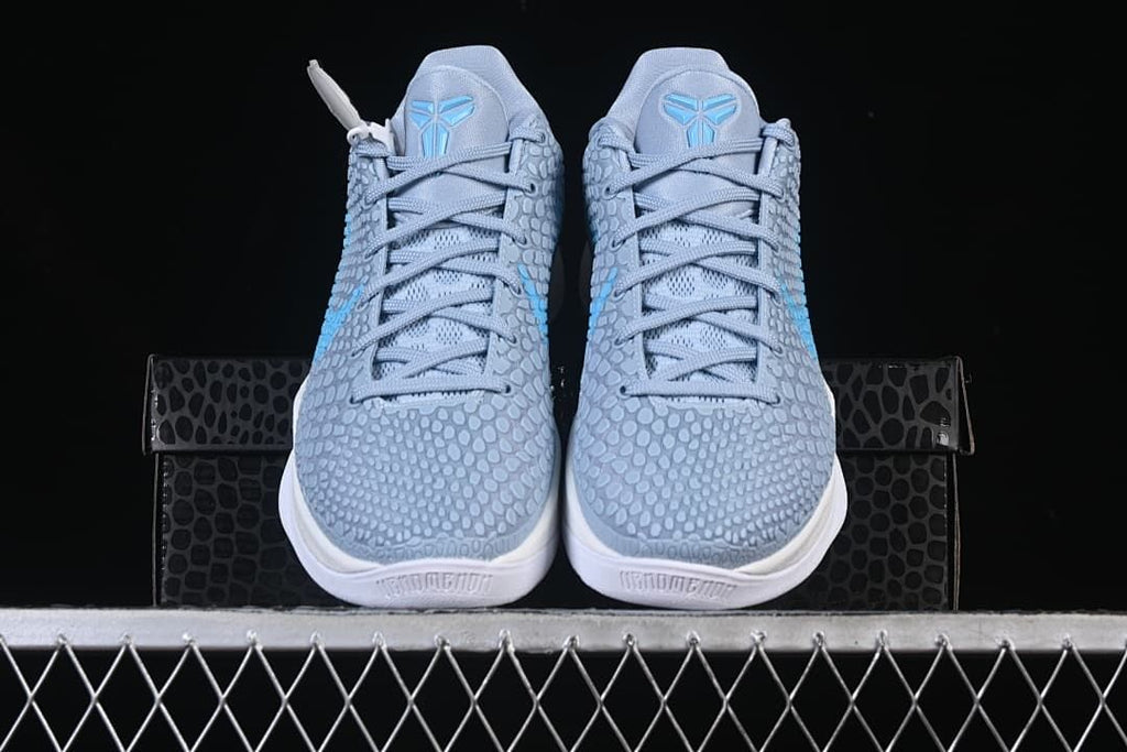 Front view of both shoes displayed on the shoe box