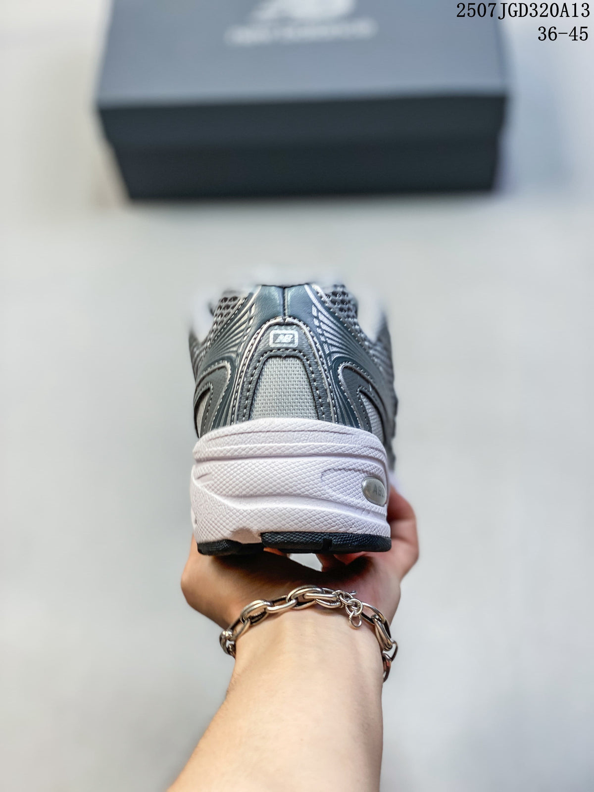 Rear view of a silver New Balance 740 sneaker