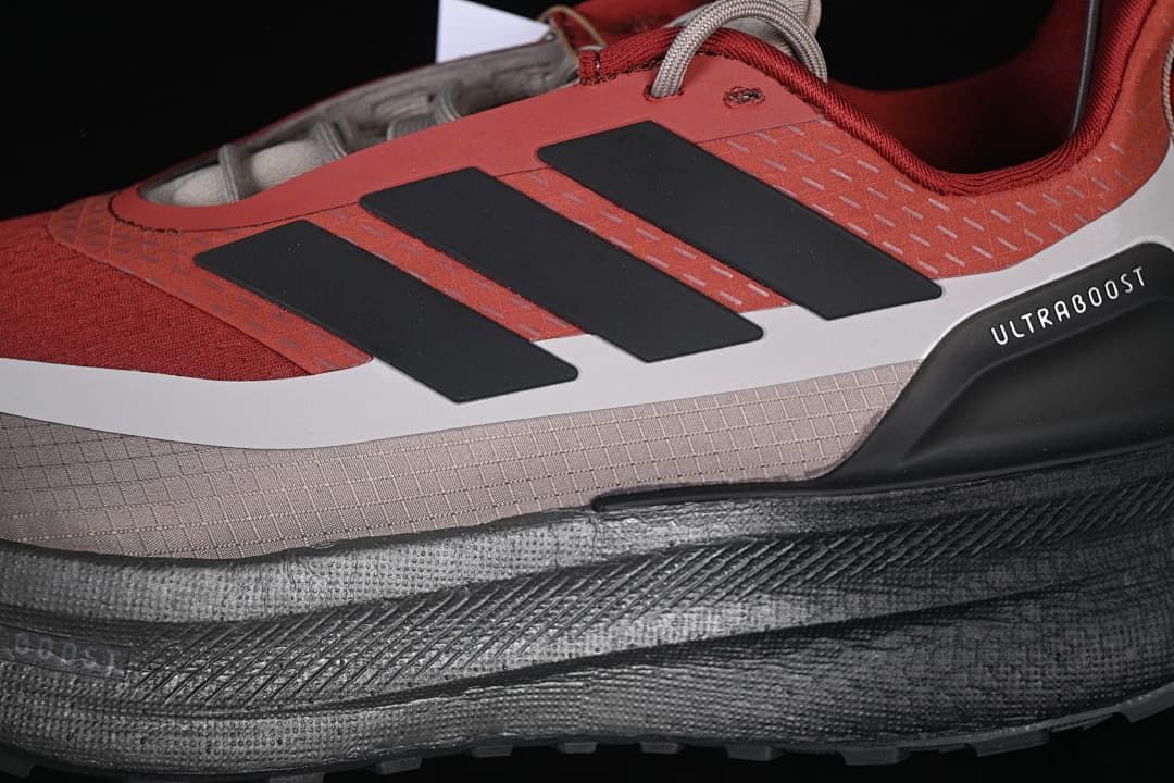 Close-up of black adidas stripes and Ultraboost side detail