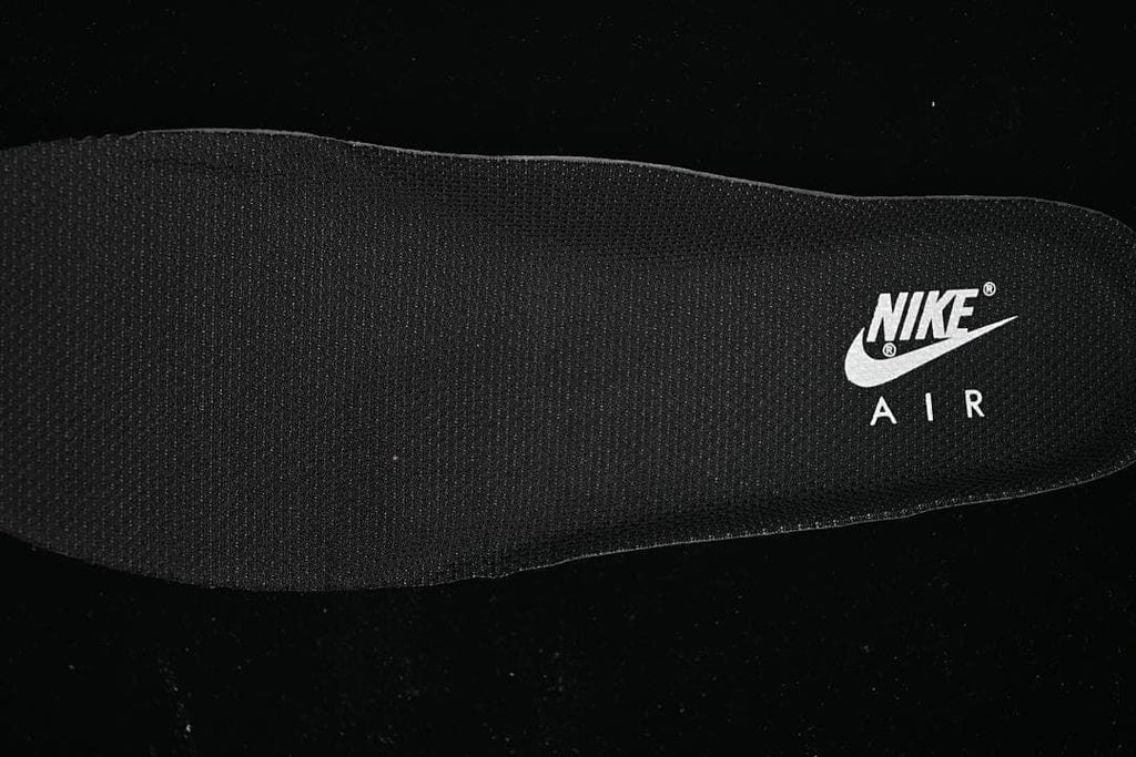 Close-up of a dark shoe insole with Nike Air branding