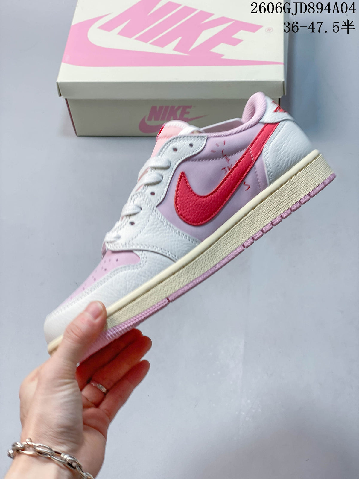 Side profile showing the red Swoosh and pink-and-white color blocking