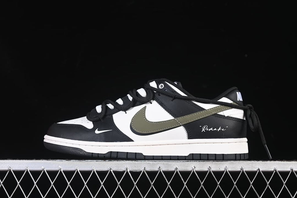 Side view of a black, white, and olive Nike SB Dunk Low sneaker