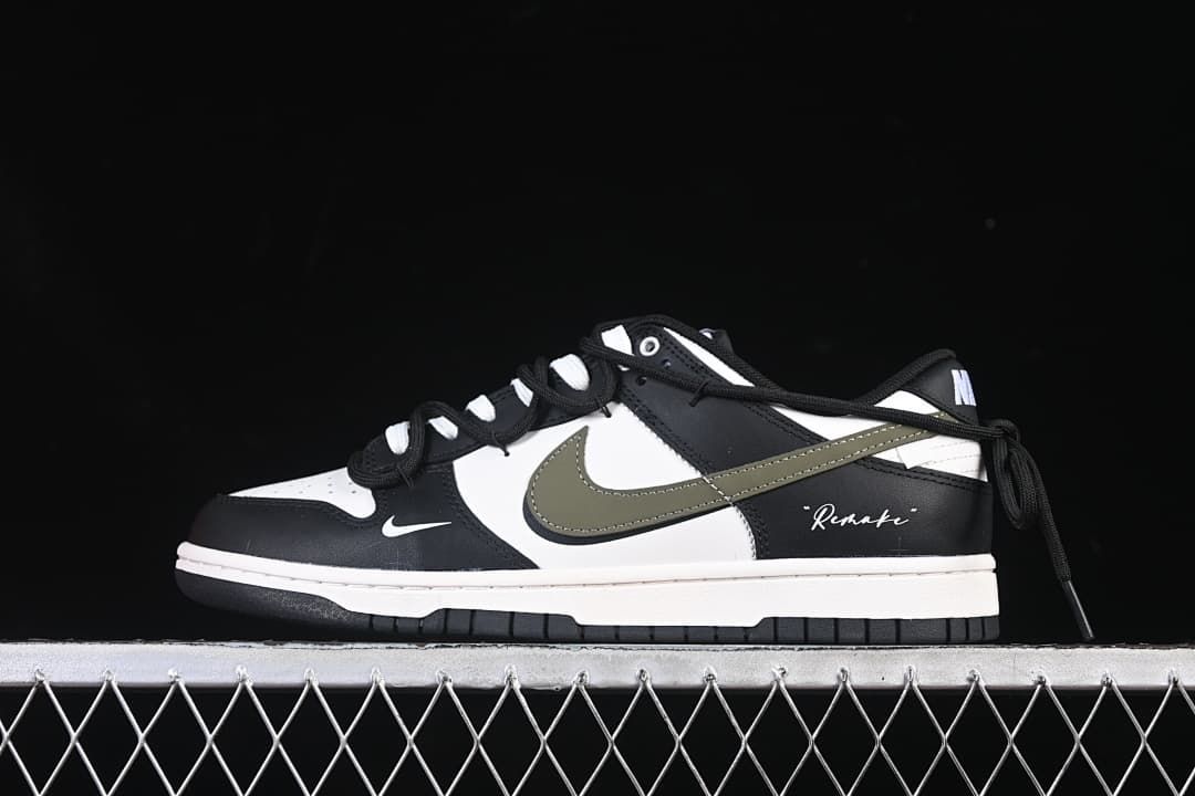 Side view of a black, white, and olive Nike SB Dunk Low sneaker