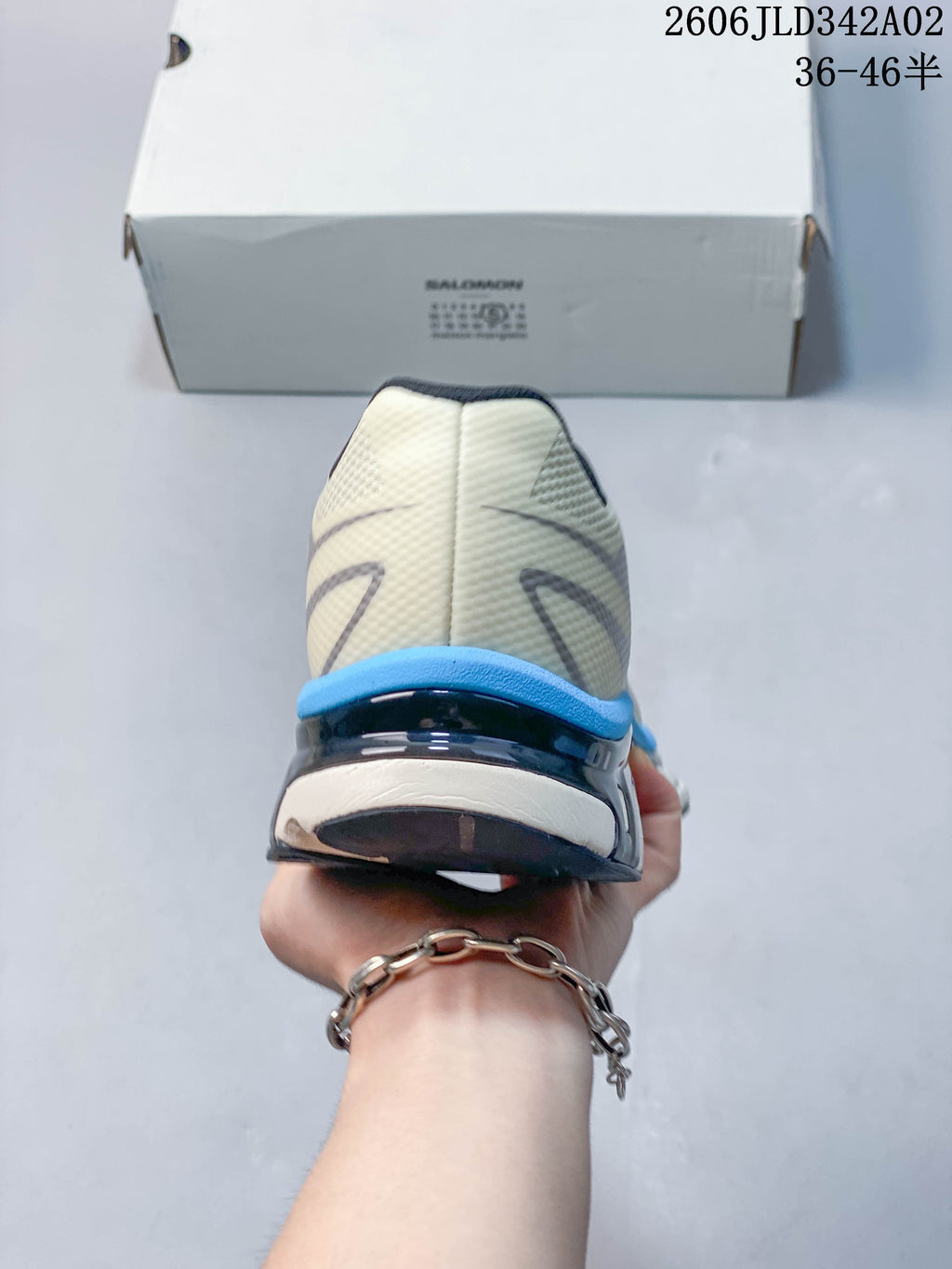 Rear view showing the heel structure and blue accent on the shoe