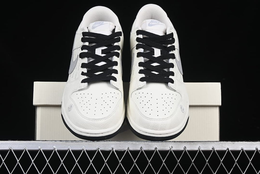 Front view of the pair showing perforated toes and black laces.