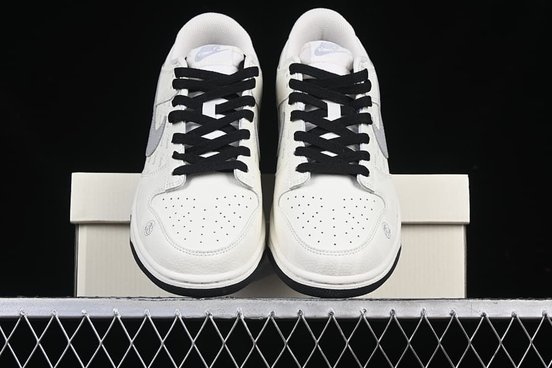 Front view of the pair showing perforated toes and black laces.