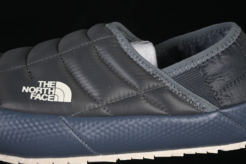 Close-up of the quilted upper, logo and contrasting blue sidewall