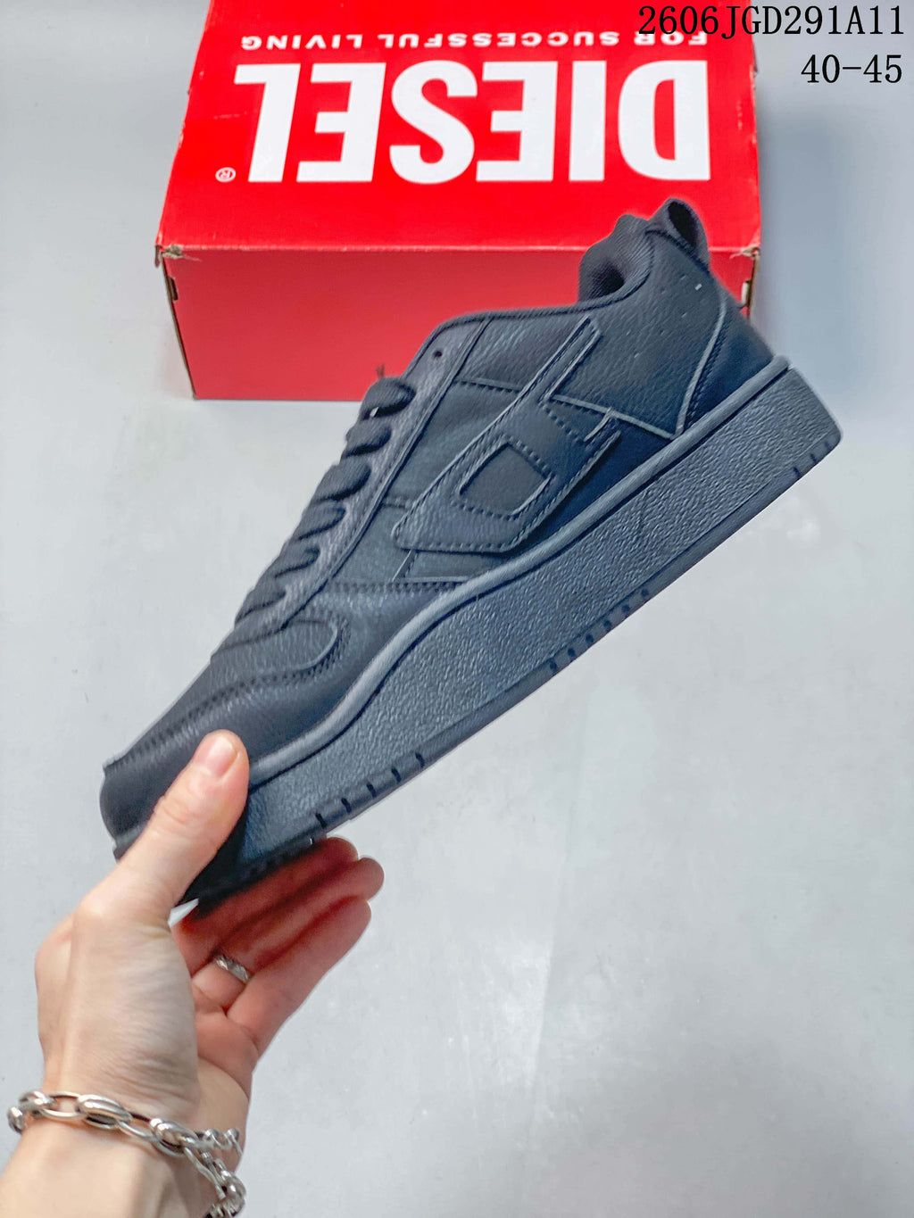 Side profile of a dark gray Diesel S-UKIYO V2 low-top sneaker