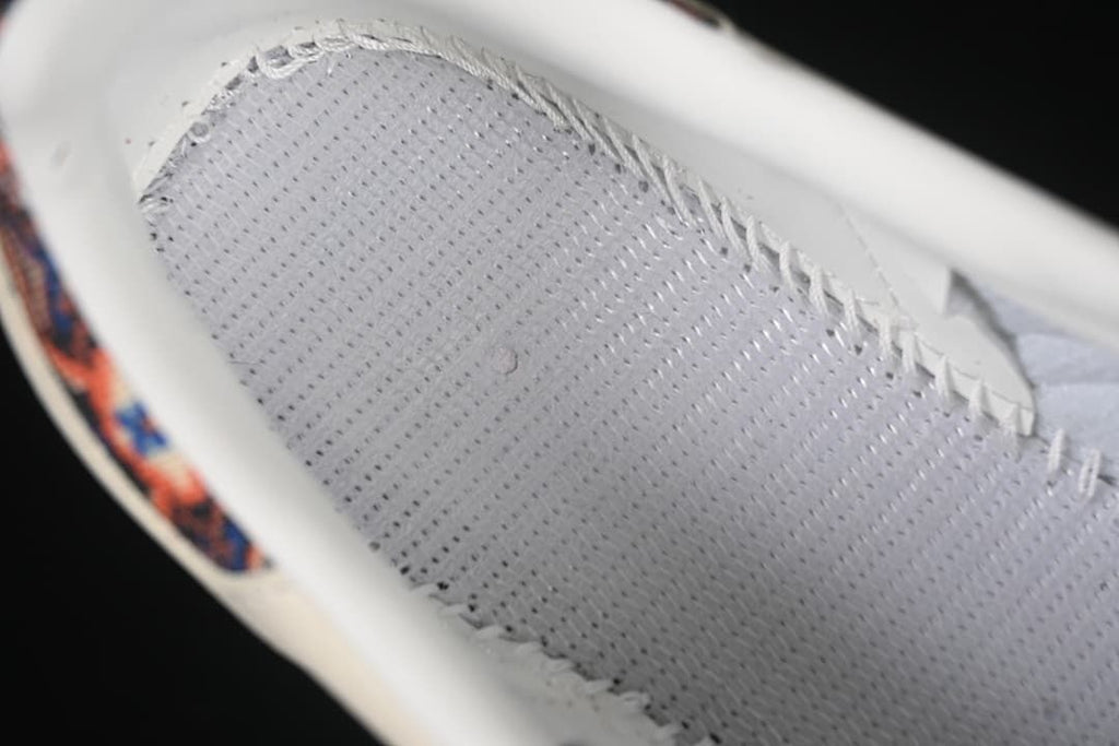 Close-up of the perforated shoe interior and stitching