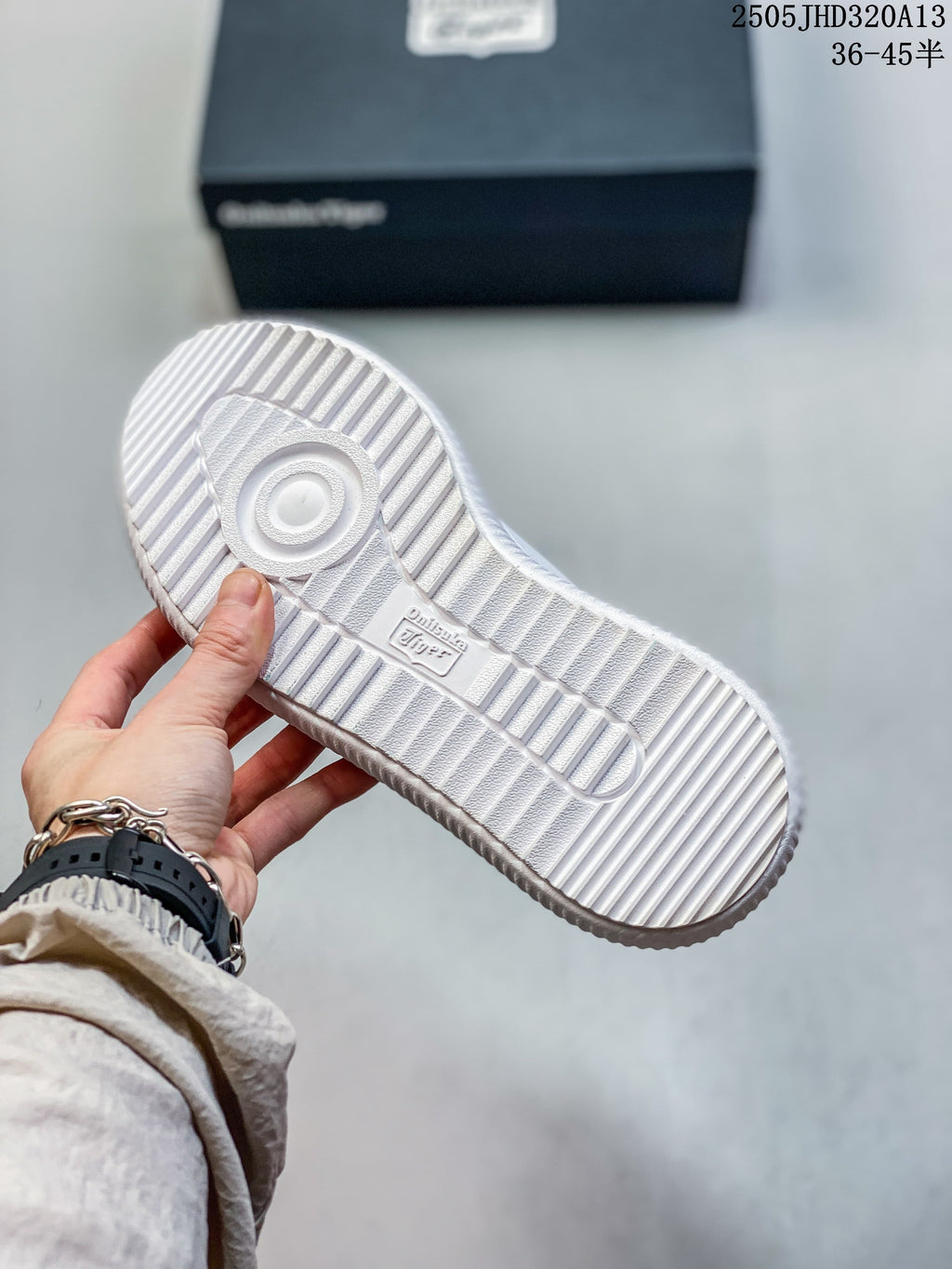 View of the white sneaker's ribbed outsole and tread.