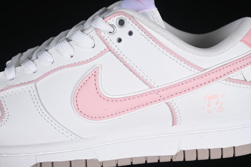 Close-up of pink side Swoosh and white upper